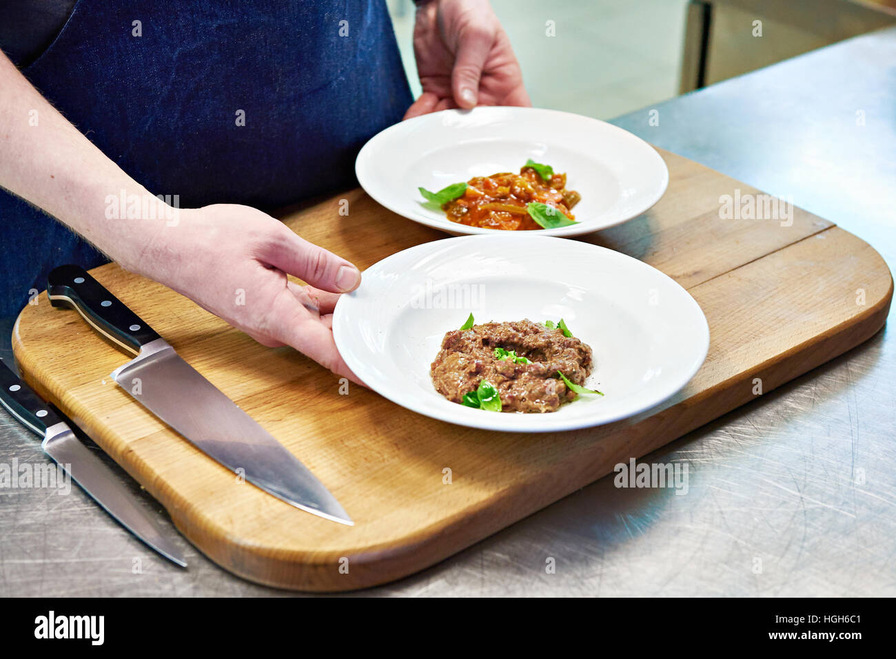 Cooking vegetable appetizers and salads in the kitchen of the restaurant Stock Photo