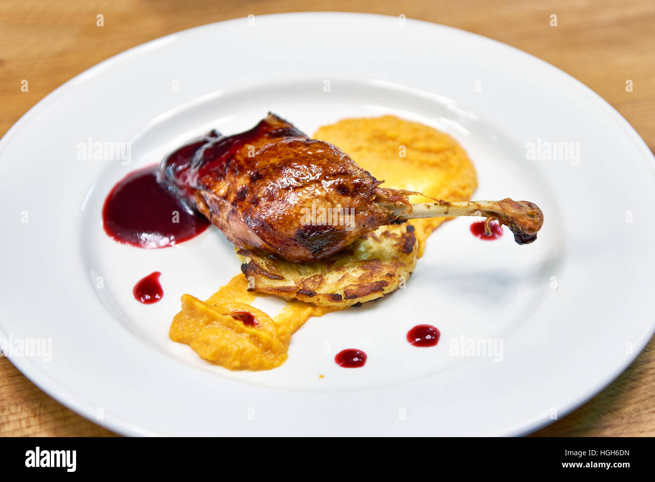 Roasted duck thigh with vegetable cutlet with sauce Stock Photo