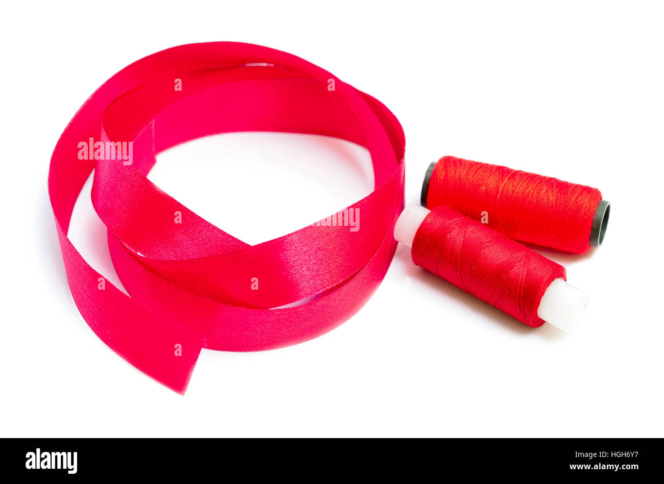 thread with ribbon isolated on white background Stock Photo - Alamy