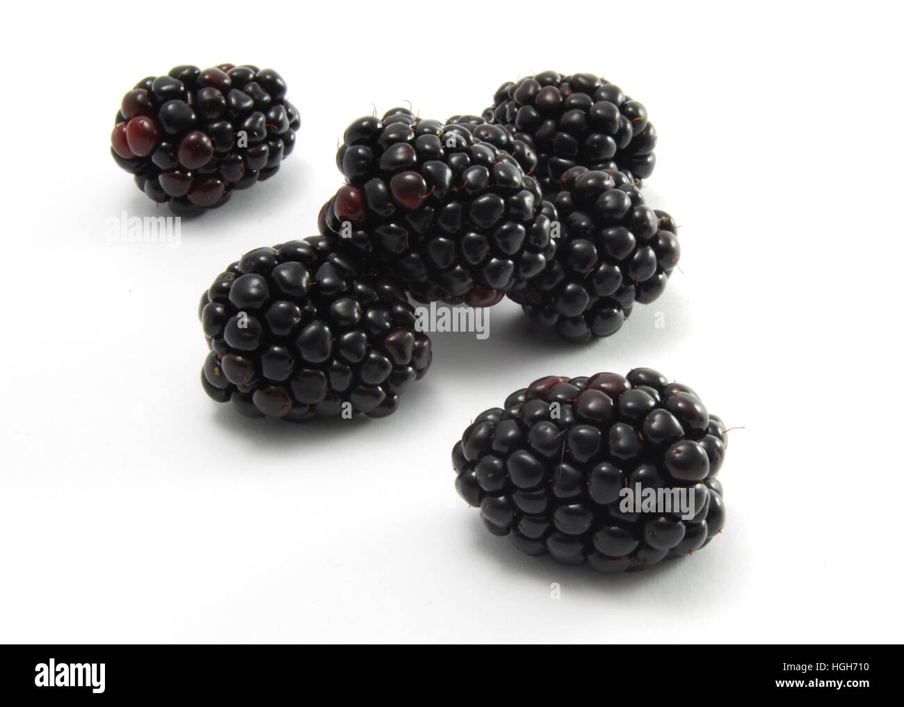 Blackberries on a white background. A healthy fruit snack. Stock Photo