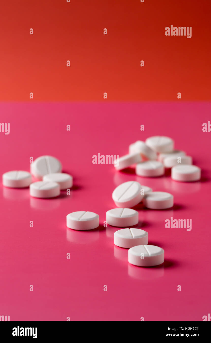 Heap of round white pills Stock Photo