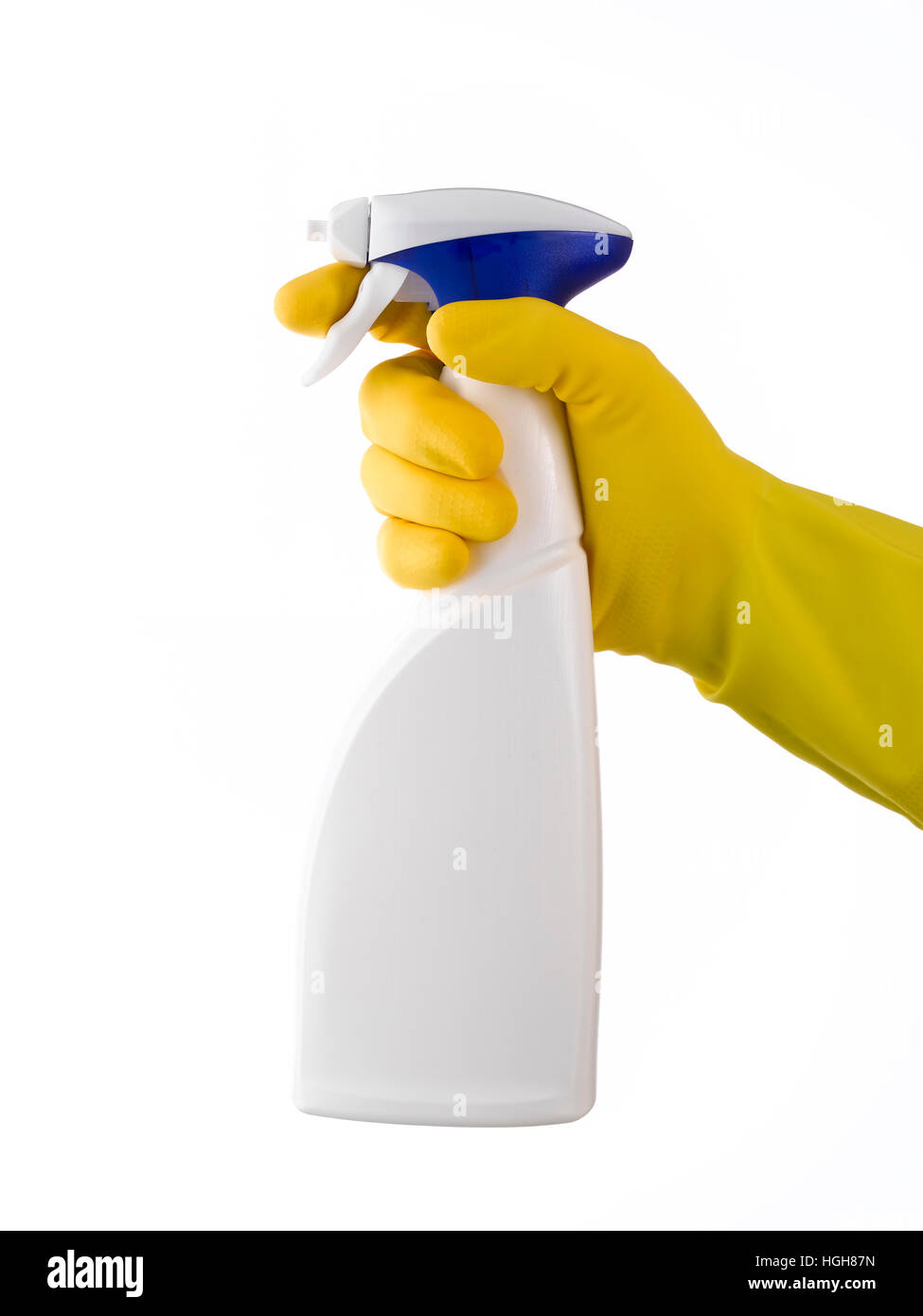 Spray gun on white being held with a yellow glove Stock Photo Alamy