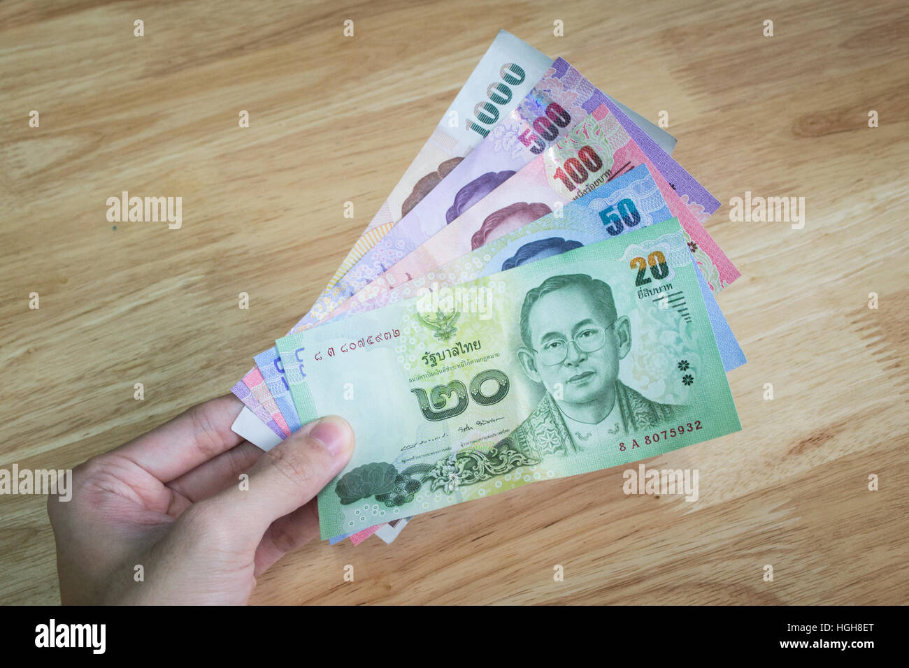All kind of Thai banknote holding in one hand Stock Photo