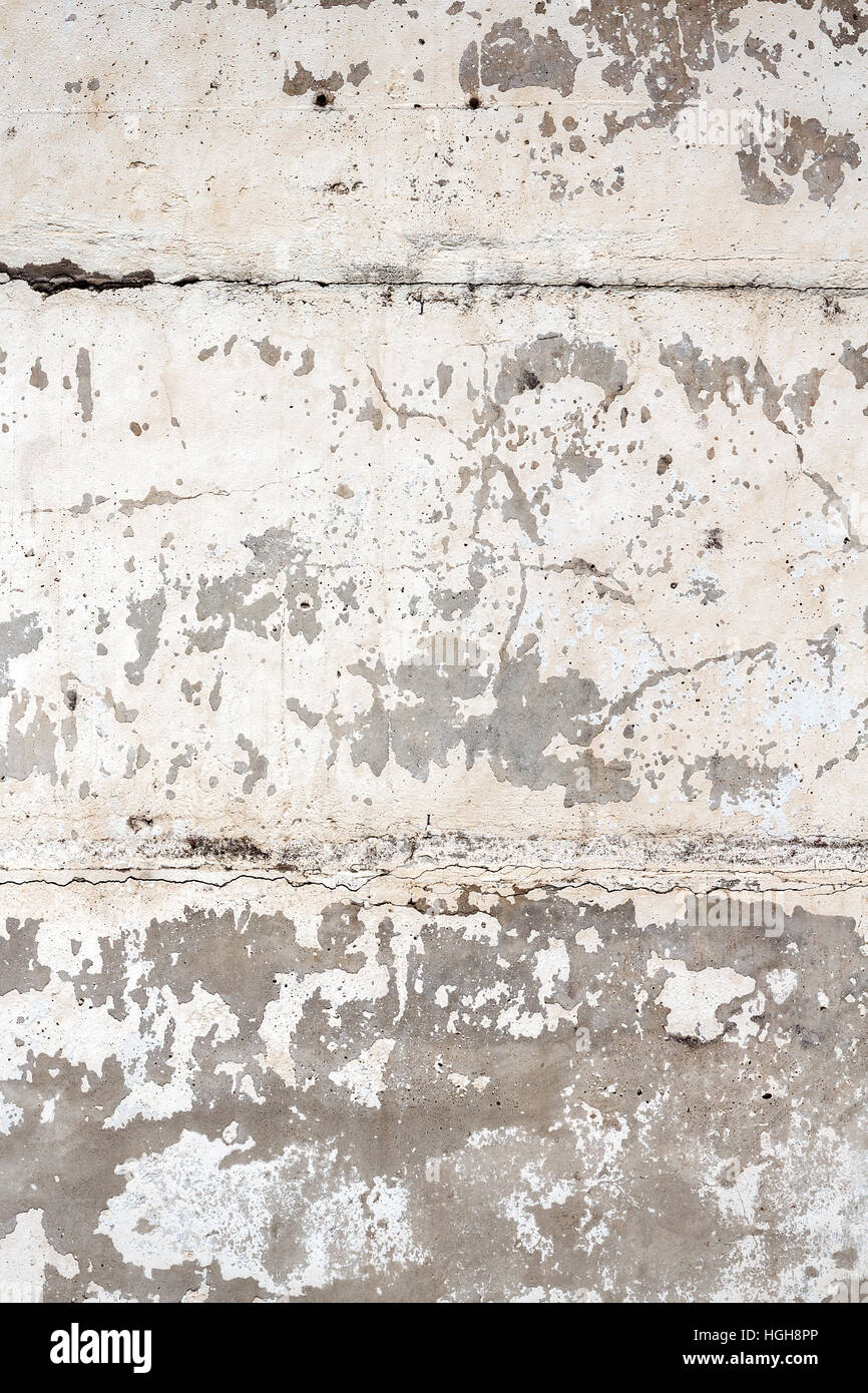 Concrete block wall background. Peeling white paint on concrete texture Stock Photo