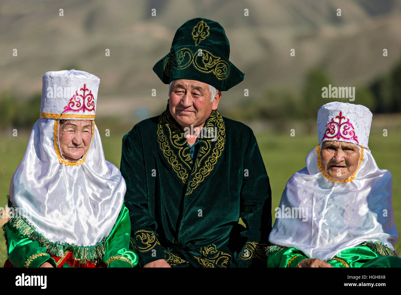 Kazakh man and women in national costumes. Stock Photo