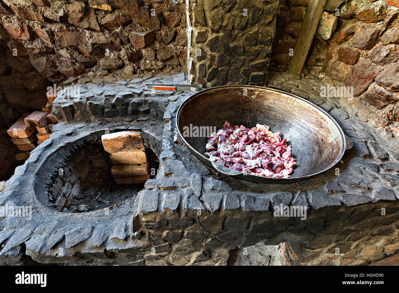 Stir fry dish in stone fire place in Kazakhstan Stock Photo