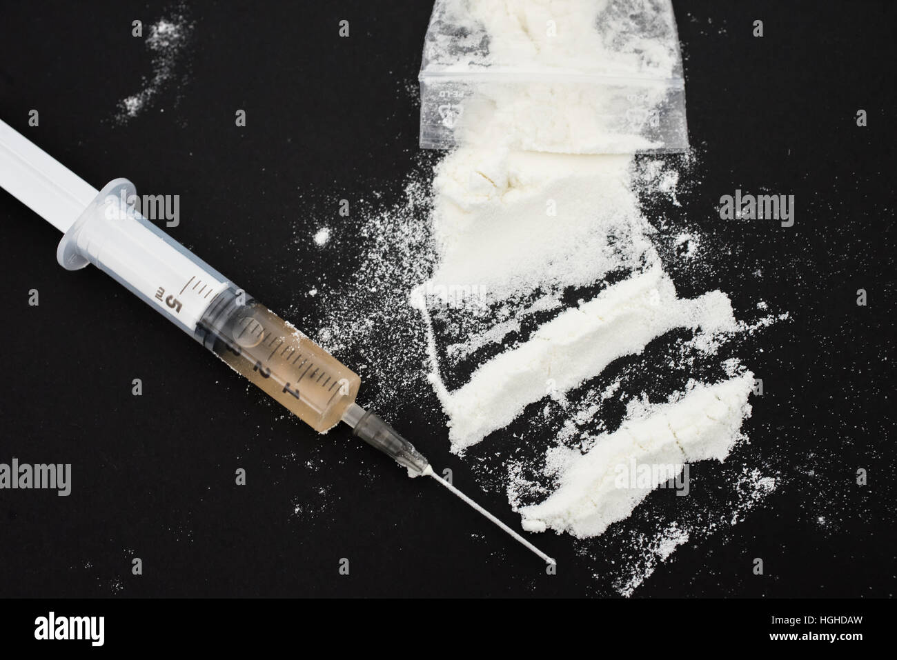 Illegal drug with syringe Stock Photo
