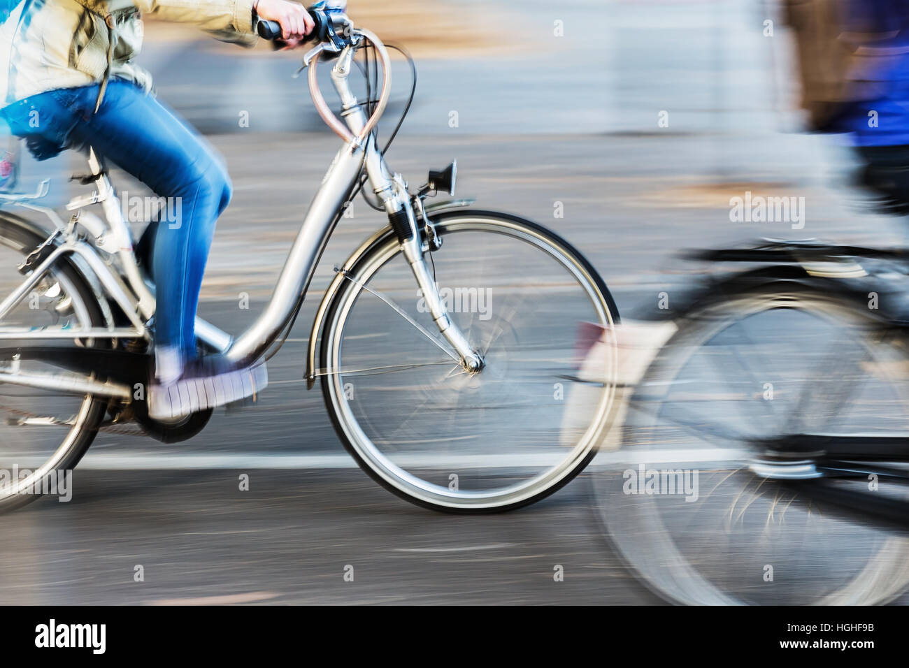 picture of bicycle riders in city traffic in motion blur Stock Photo ...