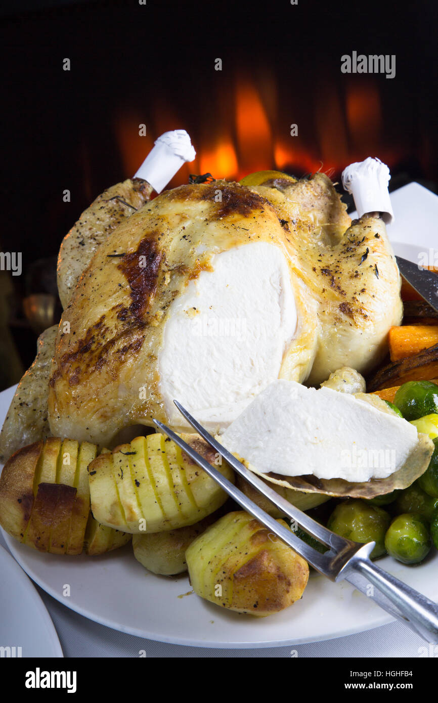 Whole Roast Chicken with potatoes and fresh cooked vegetables ready for