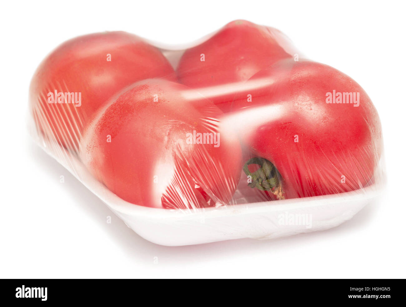 tomato in box over white background Stock Photo - Alamy