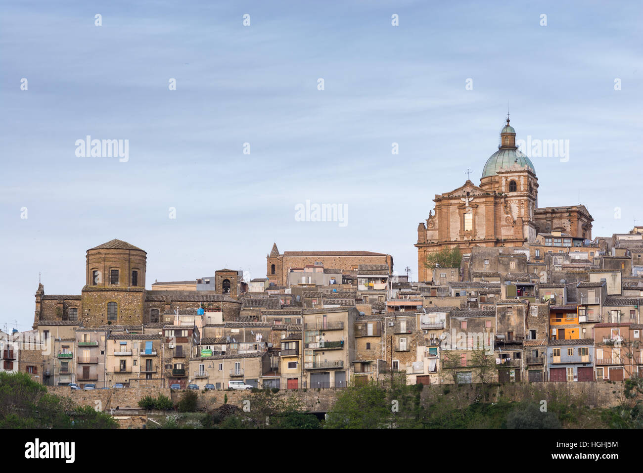 Ancient landscape of Piazza Armerina at sunset. From sunlight to night light passing through the blue hour. You see the baroque cathedral, Holy Mary o Stock Photo