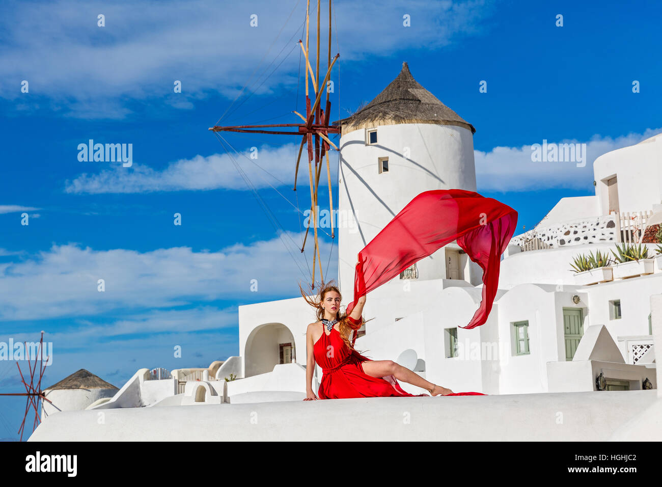 Beautiful young woman in red dress Stock Photo - Alamy