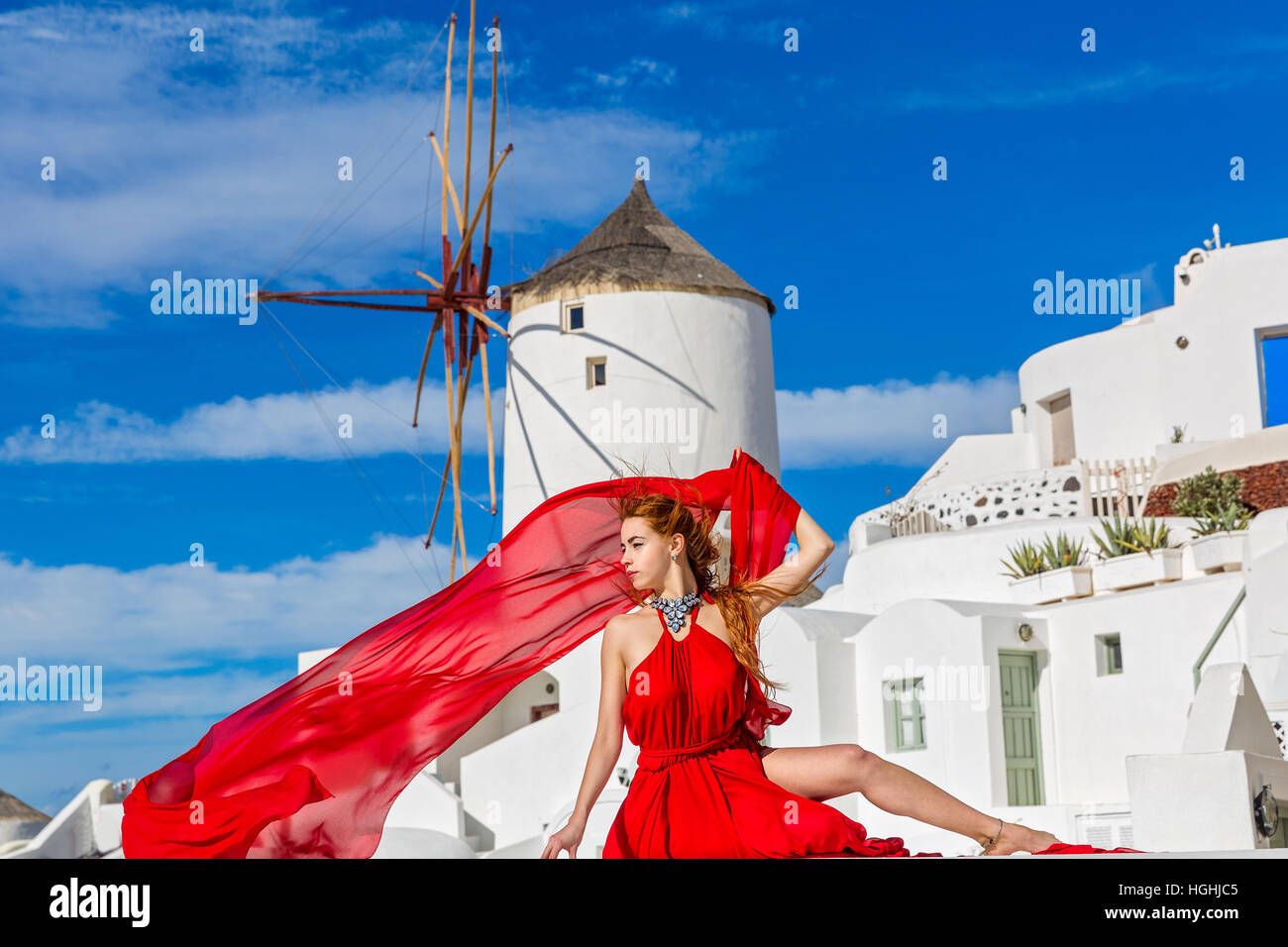 Beautiful young woman in red dress Stock Photo - Alamy