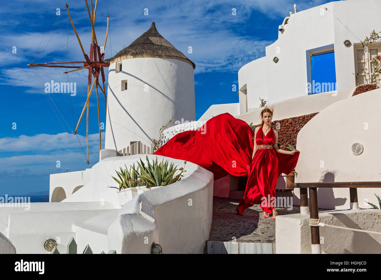 Beautiful young woman in red dress Stock Photo - Alamy