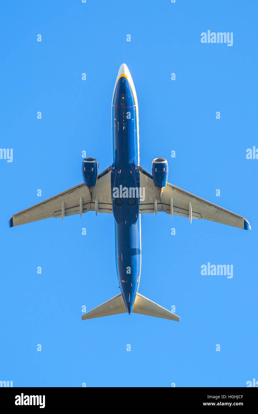 blue plane in the sky Stock Photo