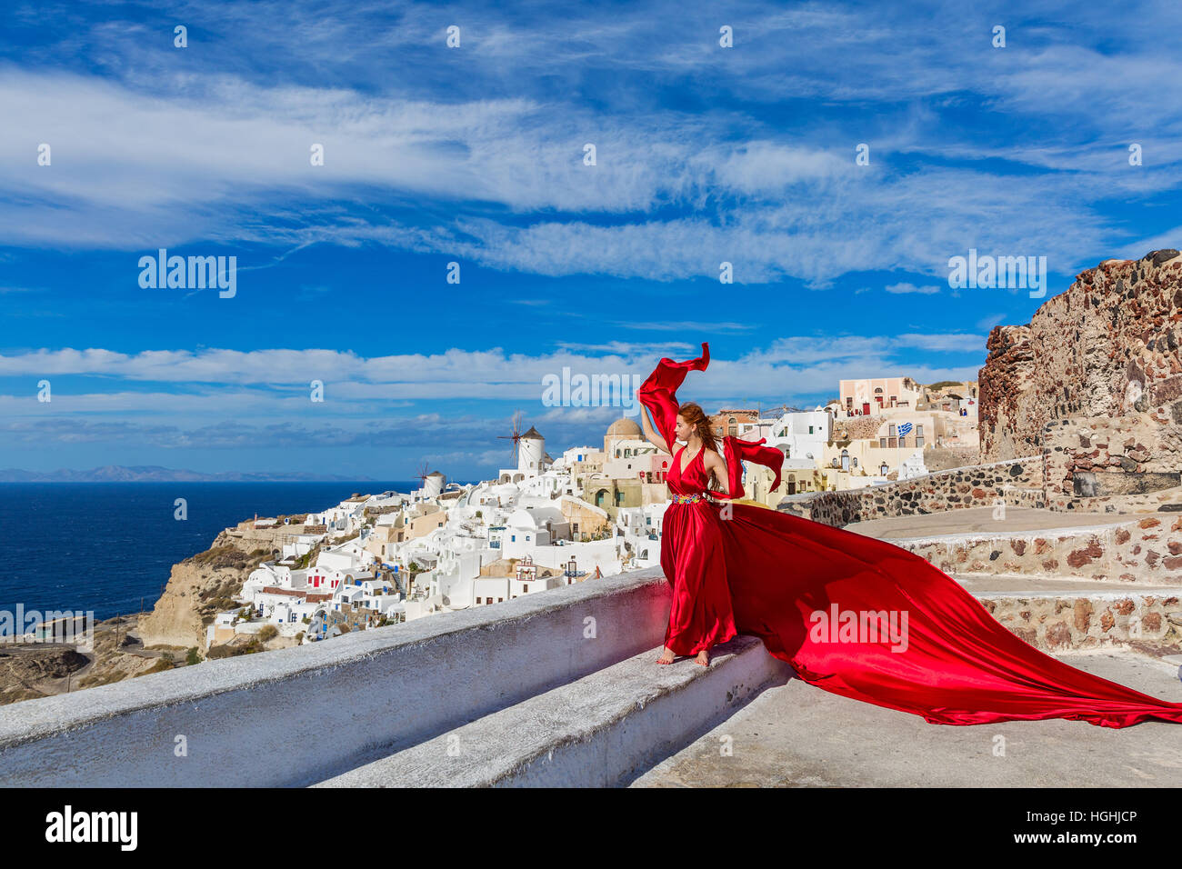 Beautiful young woman in red dress Stock Photo - Alamy