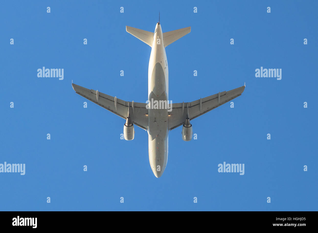 white plane in the sky Stock Photo