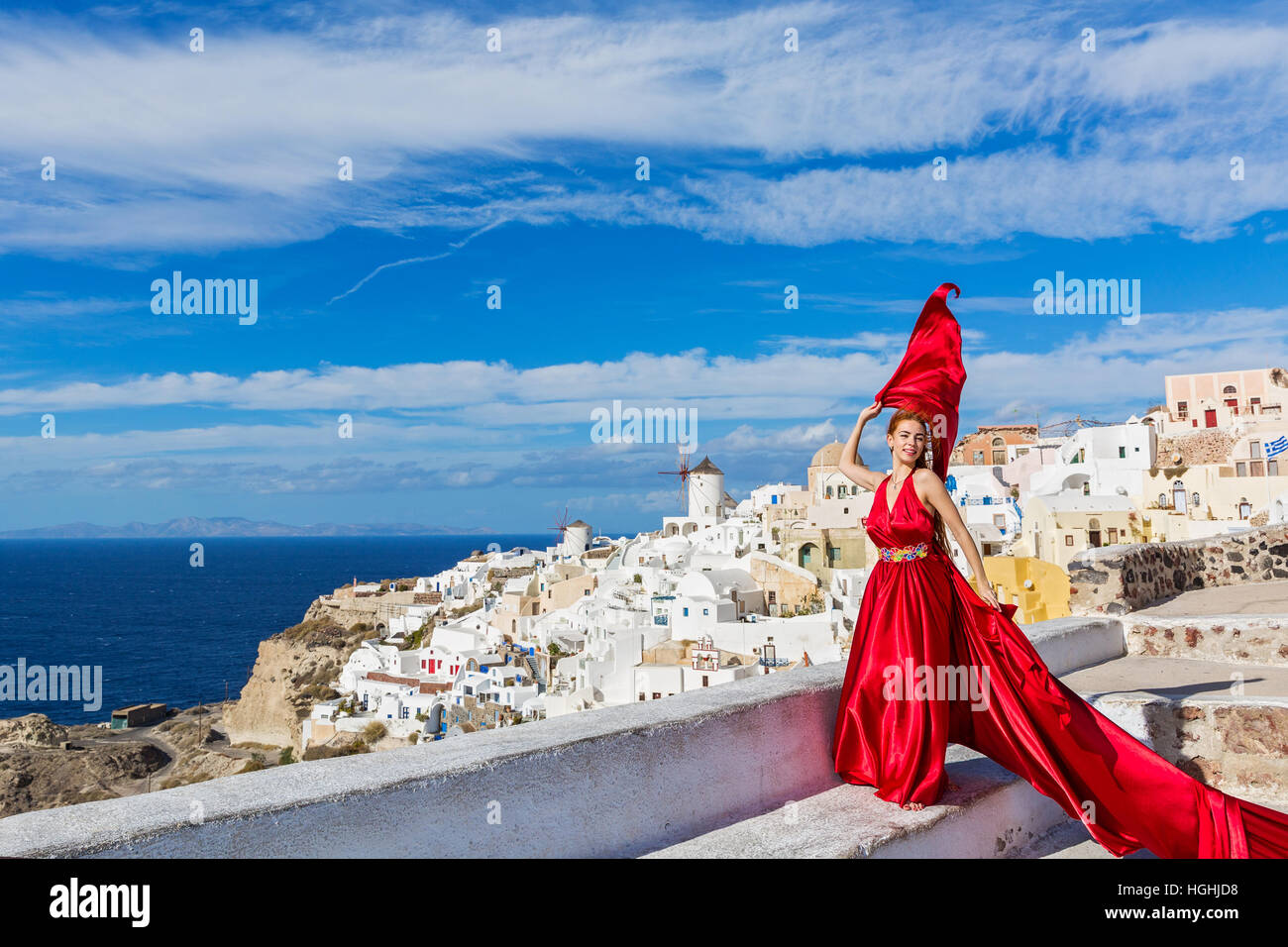 Beautiful young woman in red dress Stock Photo - Alamy
