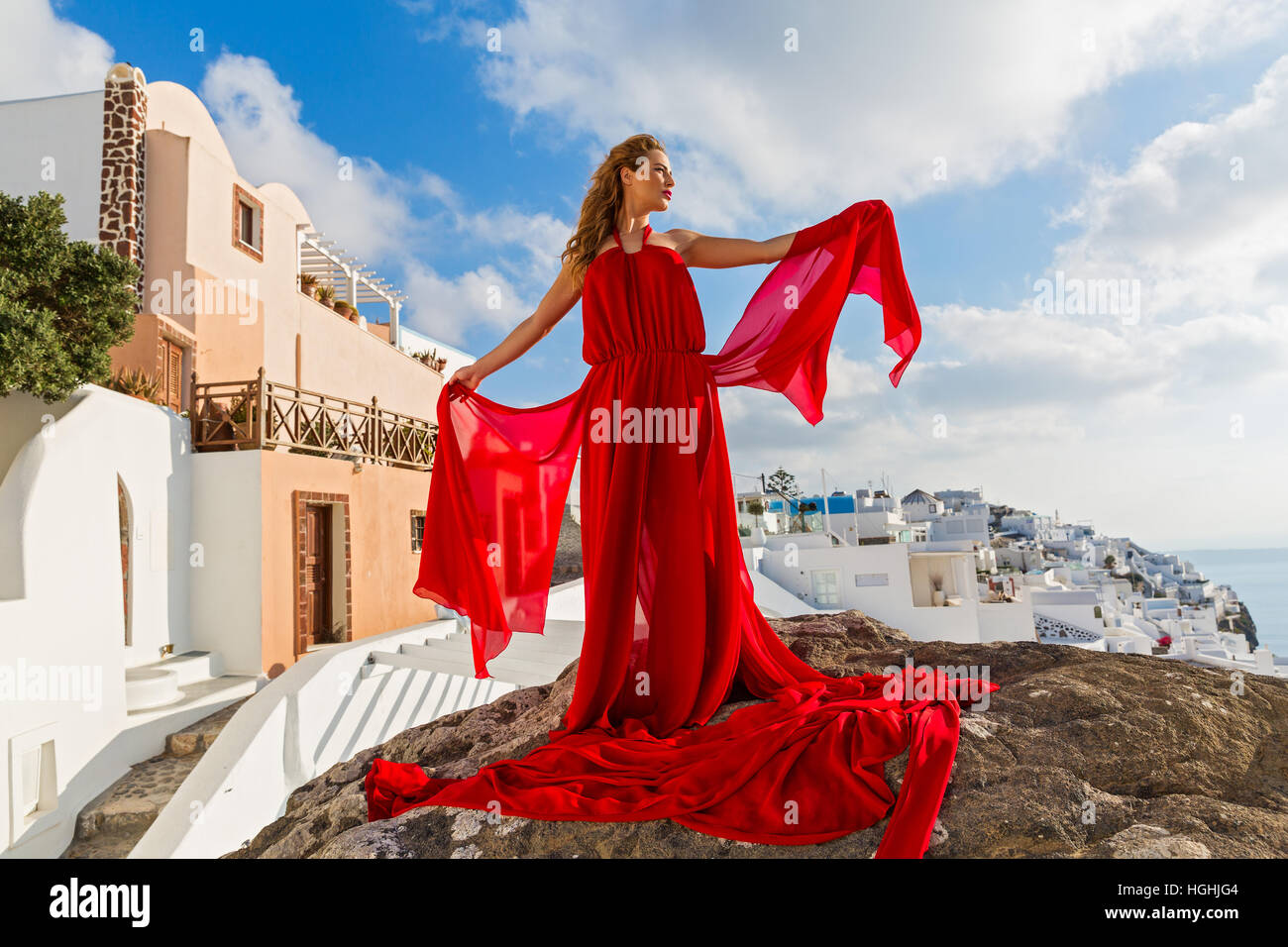 Woman in a beautiful red dress Stock Photo - Alamy