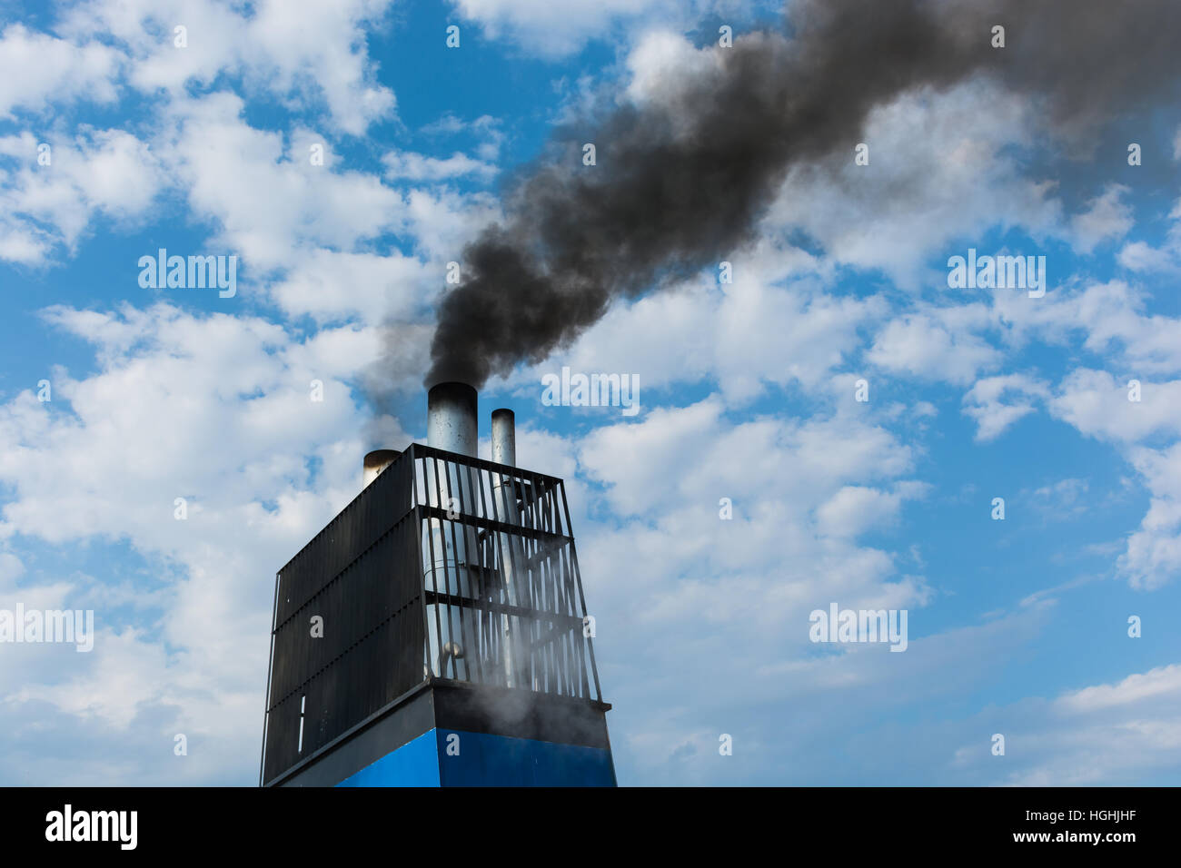 Aboard, chimney of a ferry or cruise ship, black smoke. Pollutes the ...