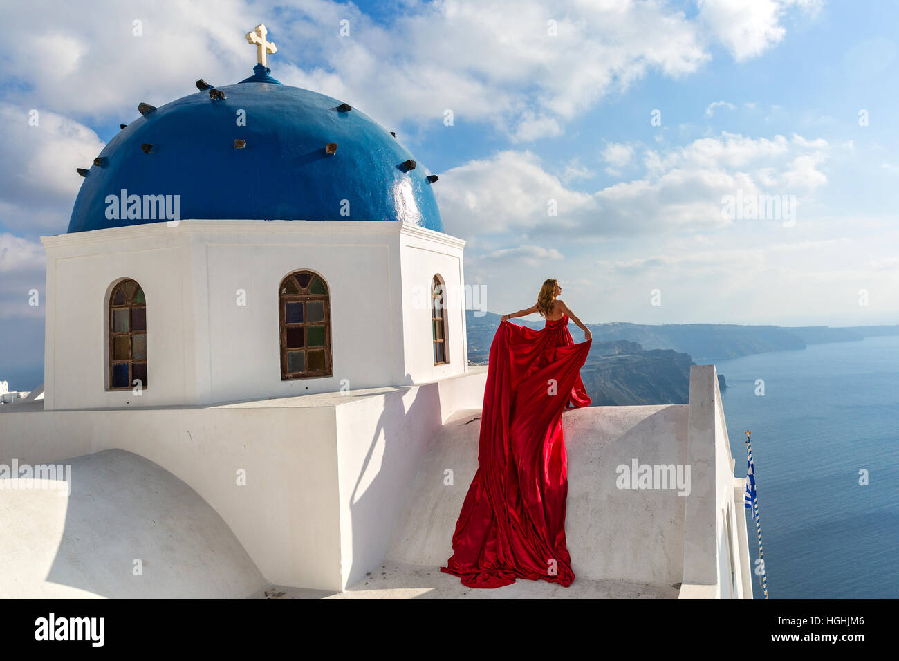 Beautiful woman in a red dress Stock Photo - Alamy