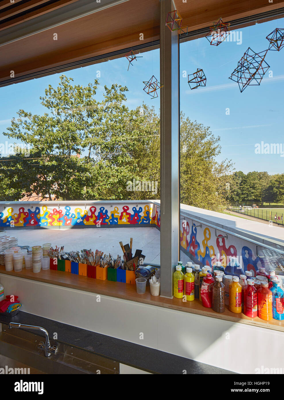 Art studio window with view across balcony and school grounds. Highgate