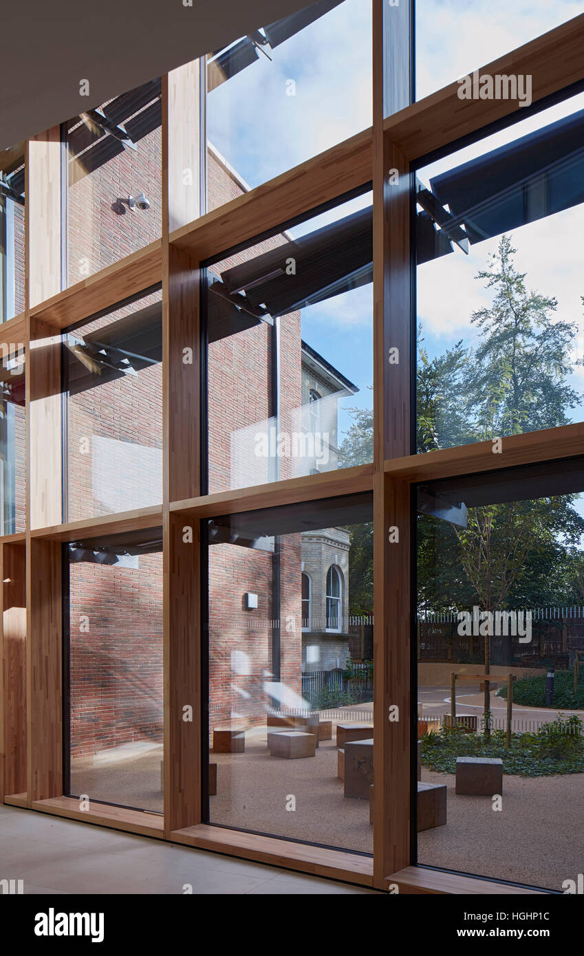 View towards exterior courtyard. Highgate Shool, London, United Kingdom. Architect: Architype Limited, 2016. Stock Photo