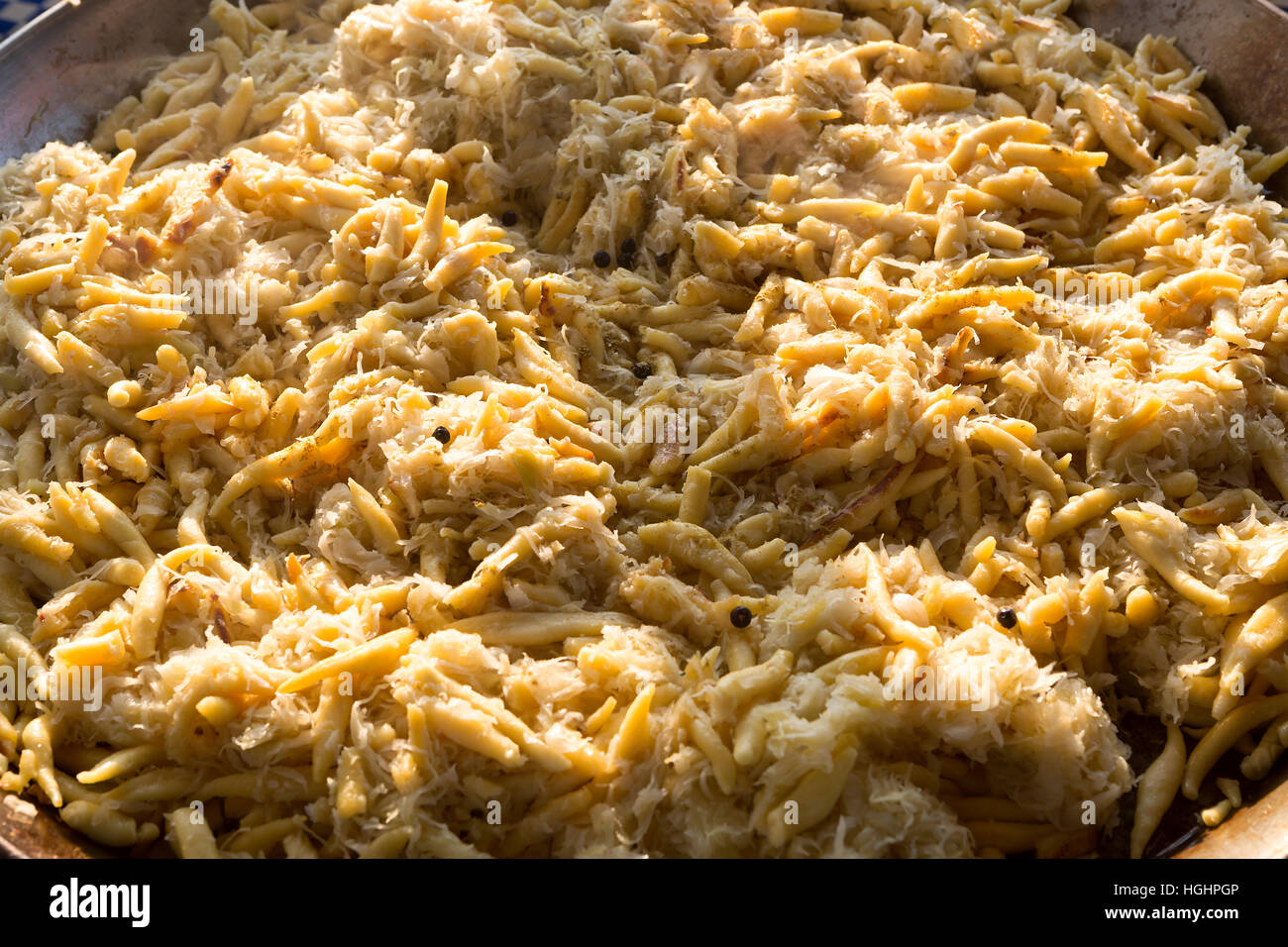 Typical Bavarian golden potato dumplings with sauerkraut Stock Photo
