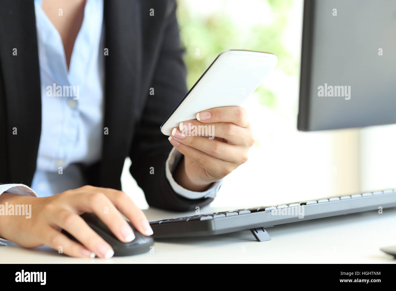 Close up of a businesswoman hands using a desktop computer mouse and ...