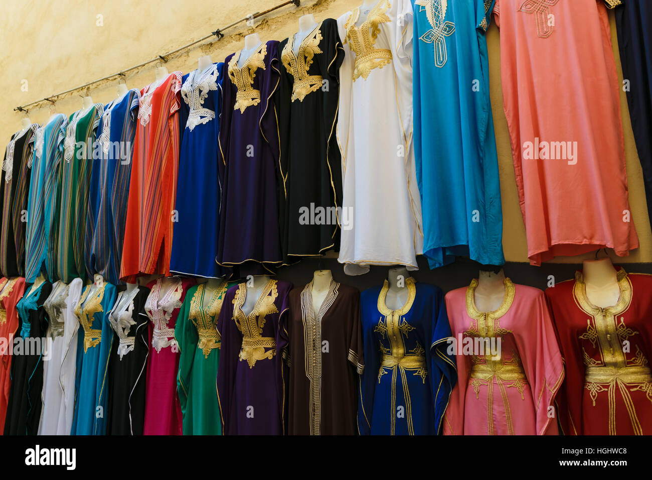 Multicolored clothes on a souk in Fez, Morocco Stock Photo