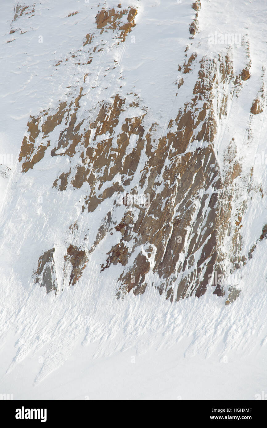 Rocks covered with snow outdoor Stock Photo - Alamy