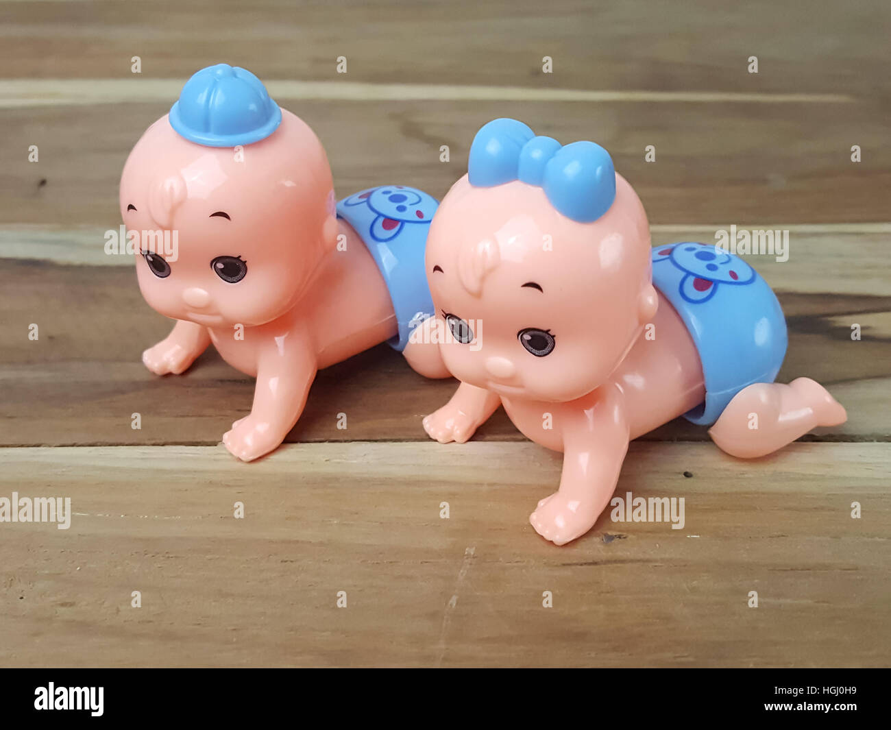 Mechanical wind up crawling baby toy on wood background Stock Photo Alamy