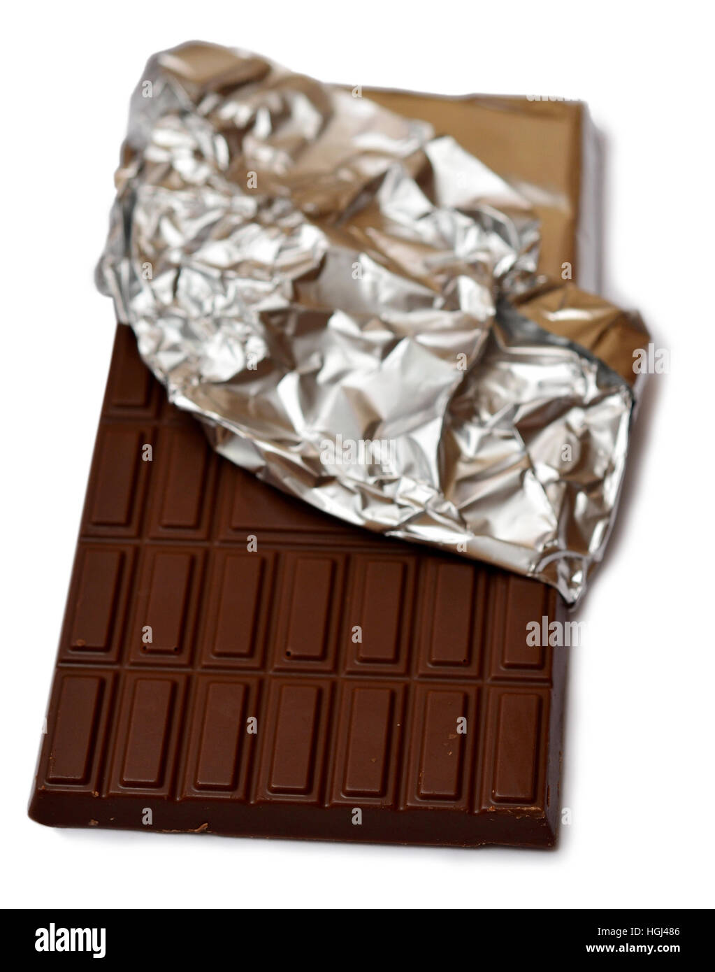 Chocolate bar in foil on white background Stock Photo - Alamy