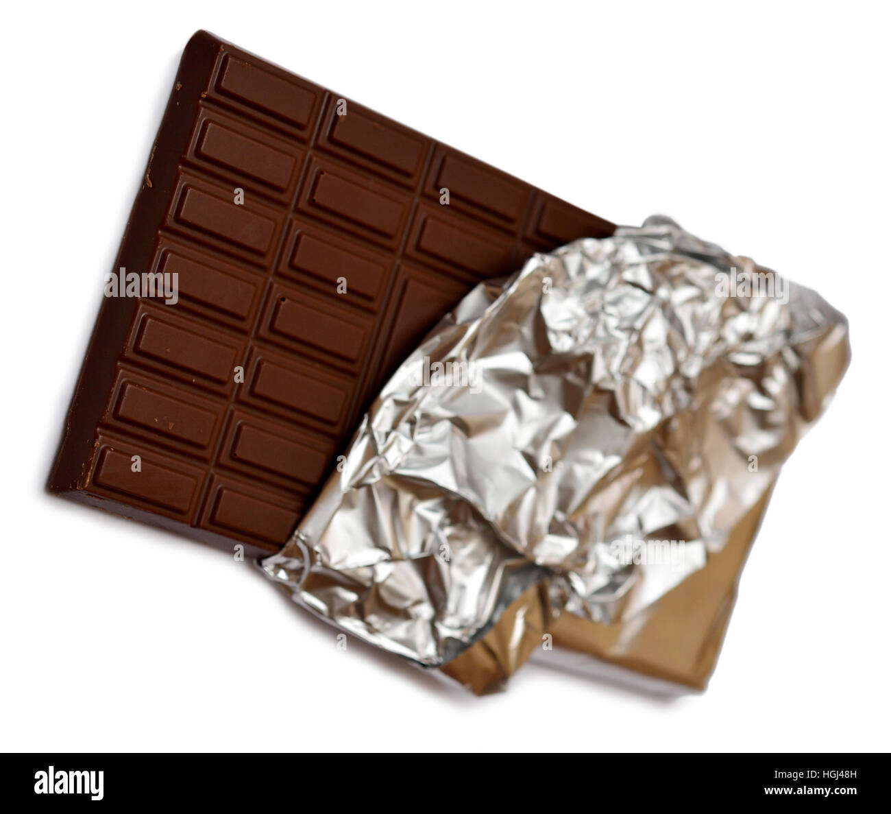 Chocolate bar in foil on white background Stock Photo - Alamy