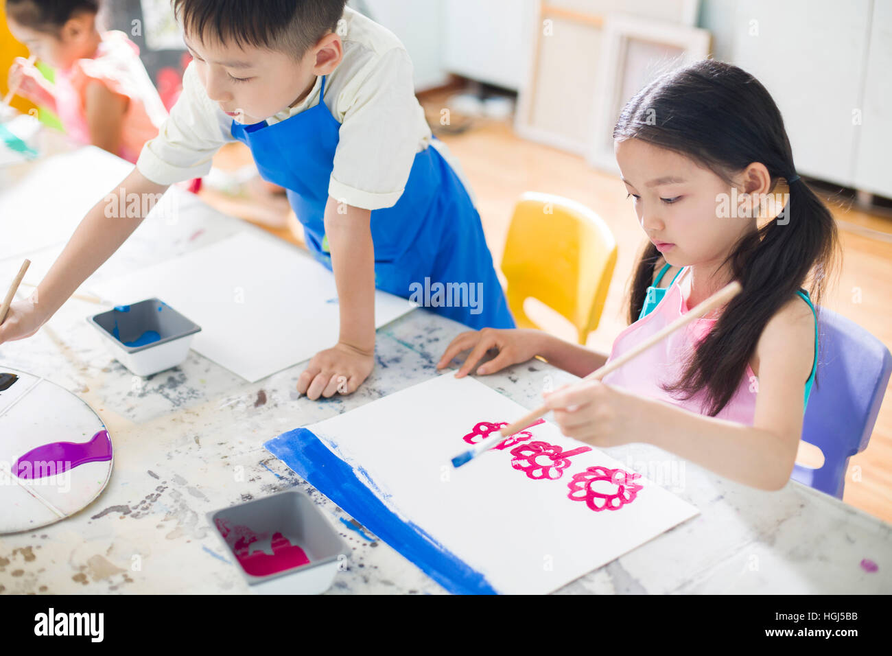 Little children painting in art class Stock Photo - Alamy