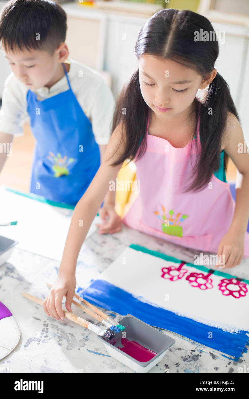 Little children painting in art class Stock Photo - Alamy