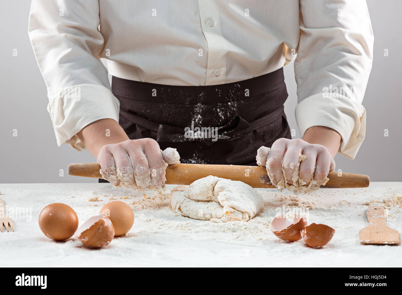 Hands kneading a dough Stock Photo - Alamy