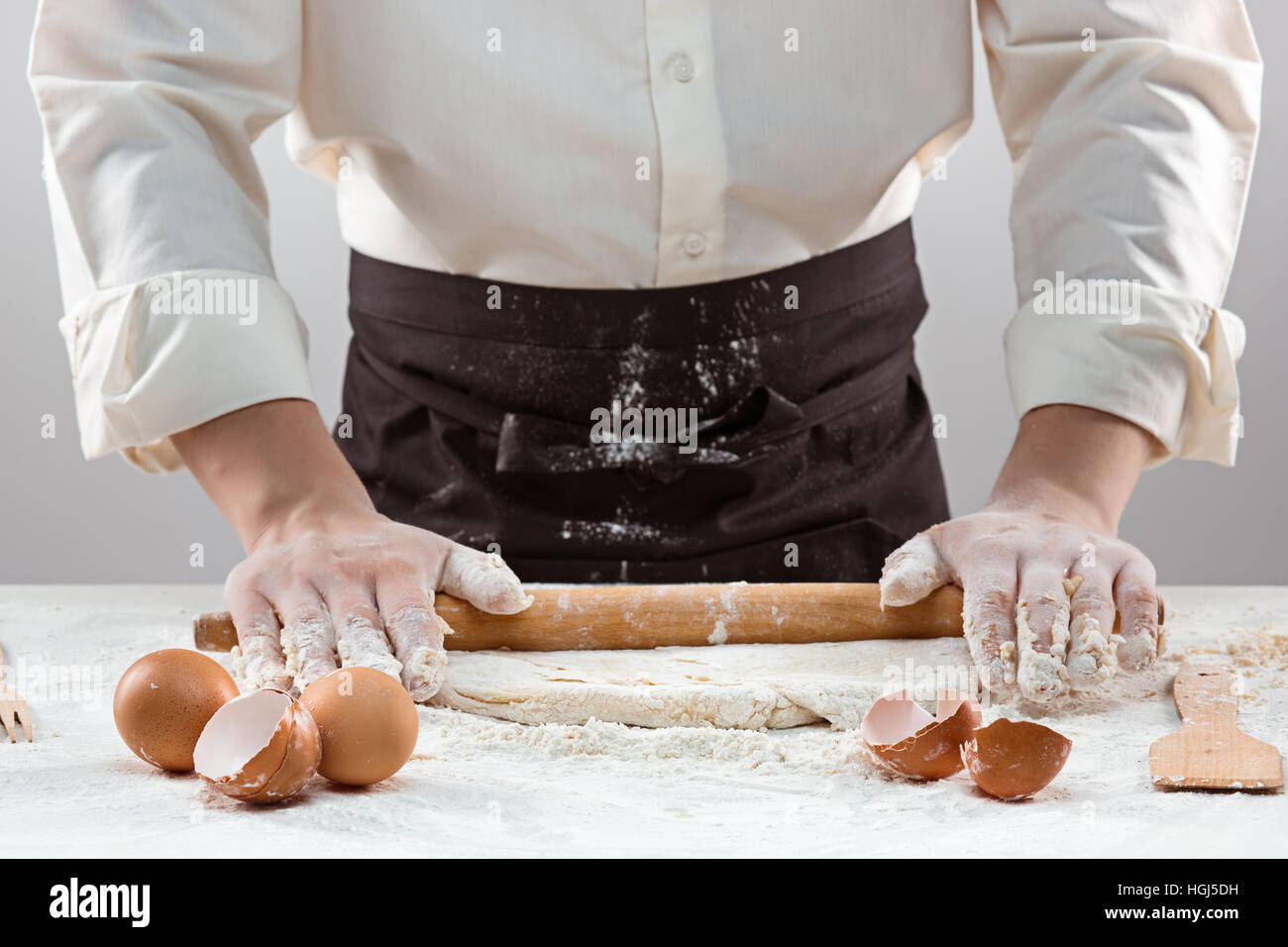 Hands kneading a dough Stock Photo - Alamy