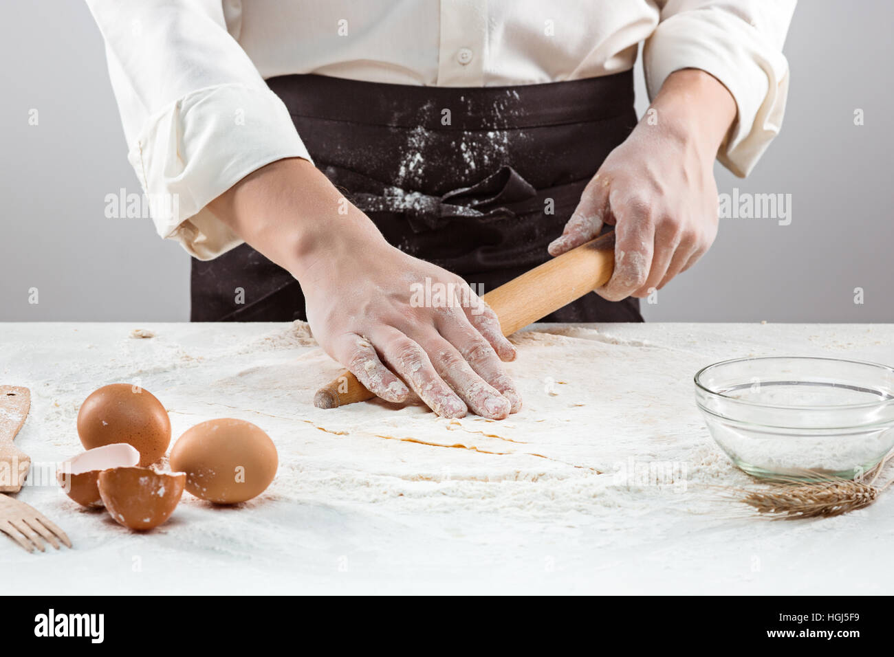 Hands kneading a dough Stock Photo - Alamy