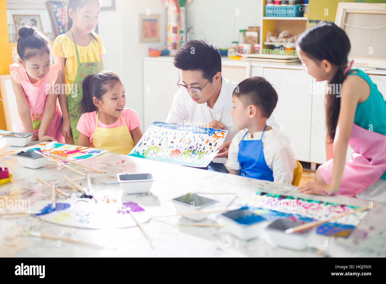Little children in art class with teacher Stock Photo - Alamy