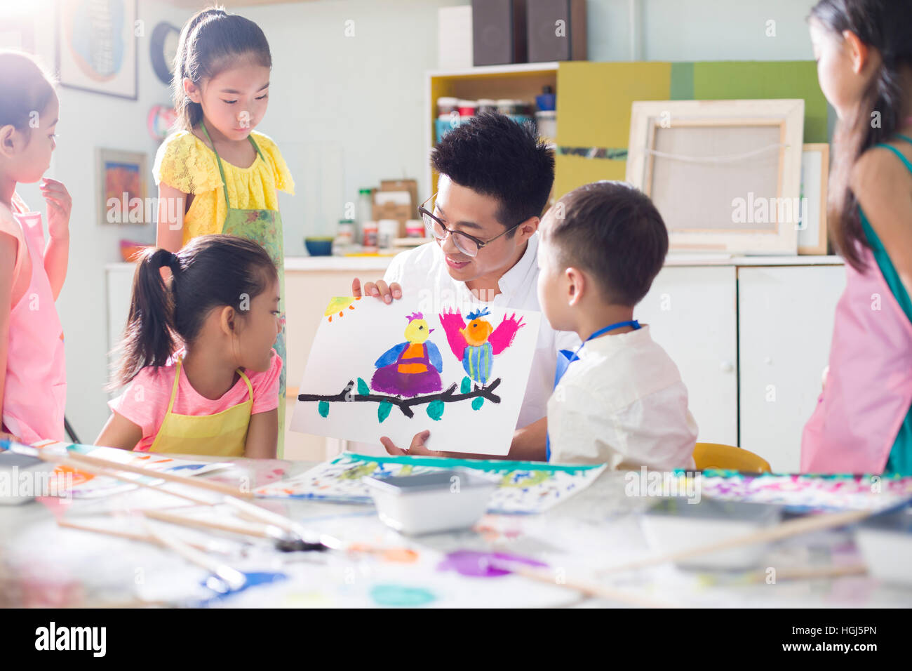 Little children in art class with teacher Stock Photo - Alamy