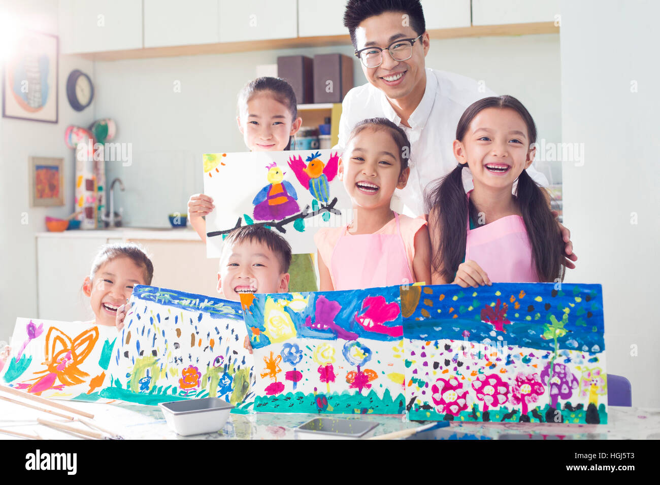 Little children in art class with teacher Stock Photo - Alamy
