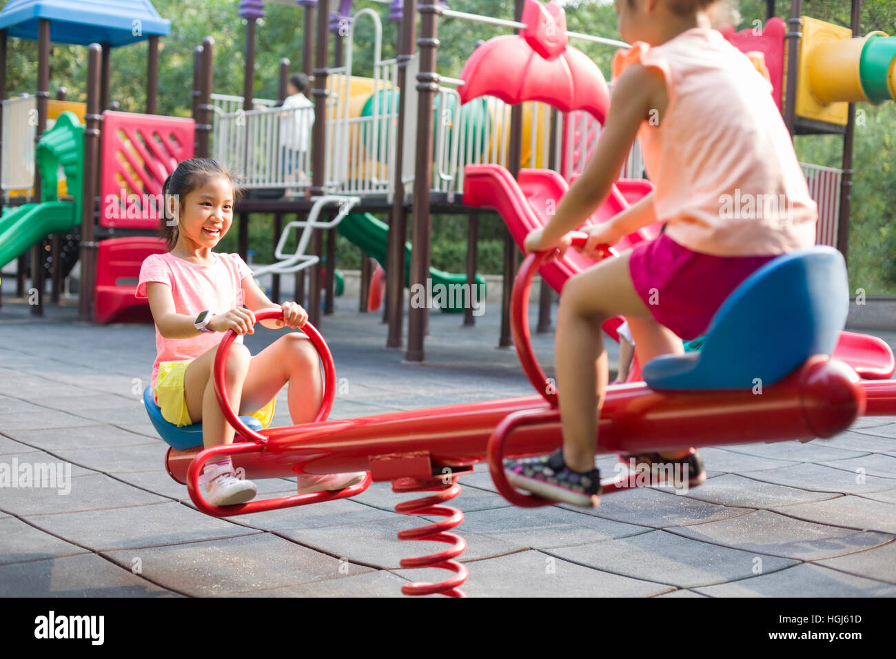 Happy children playing in park Stock Photo - Alamy