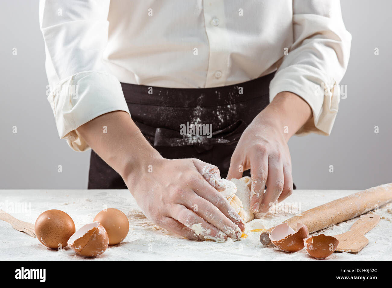 Hands kneading a dough Stock Photo - Alamy