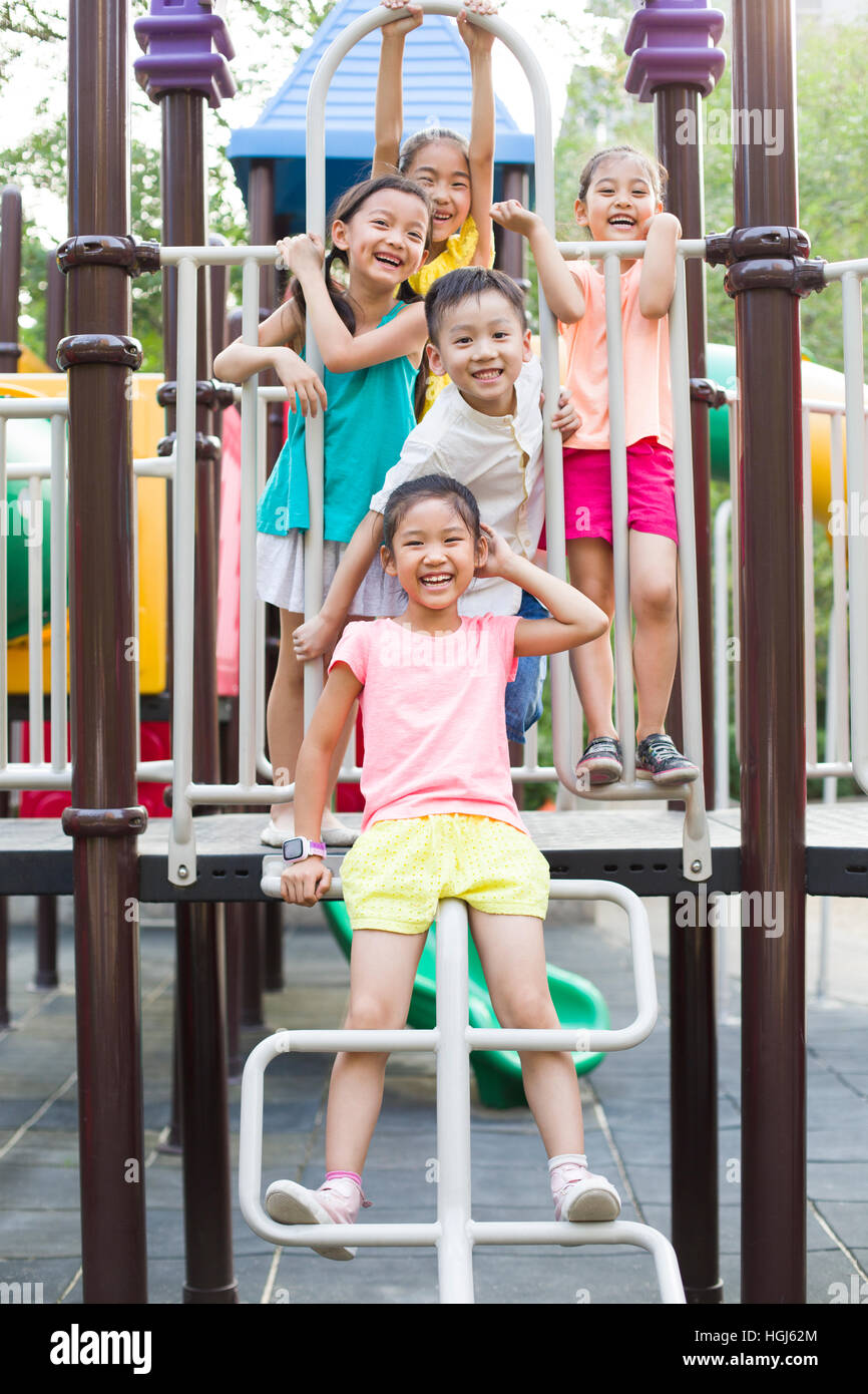 Happy children playing in park Stock Photo - Alamy