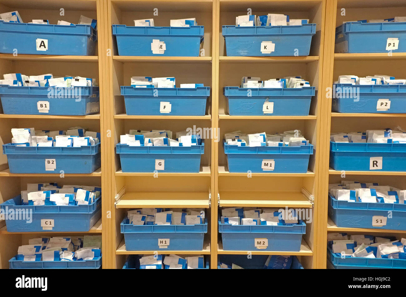 A stack of prescription boxes in a doctors surgery Stock Photo