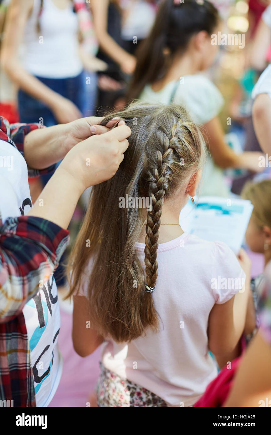 young girl and her pigtail hair. Vertical shot Stock Photo