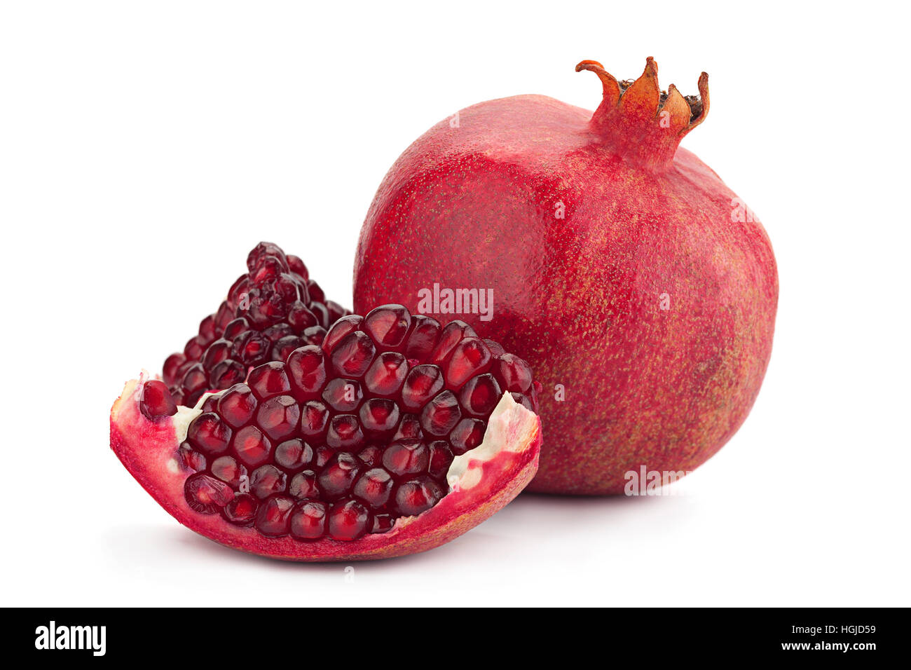 Pomegranate fruit closeup isolated on white background Stock Photo