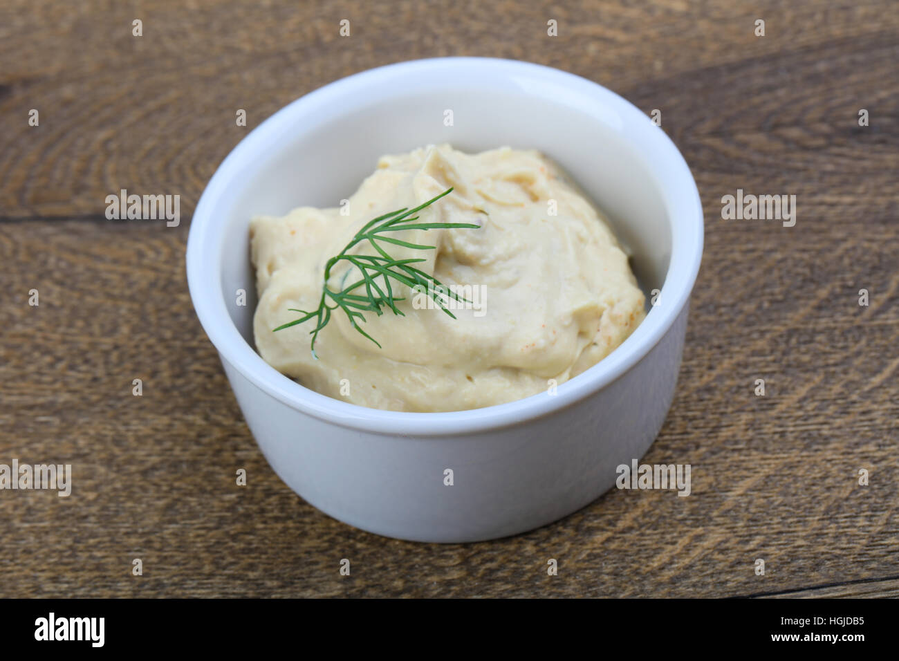 Arabic traditional cusine hummus with dill and cedar nuts Stock Photo