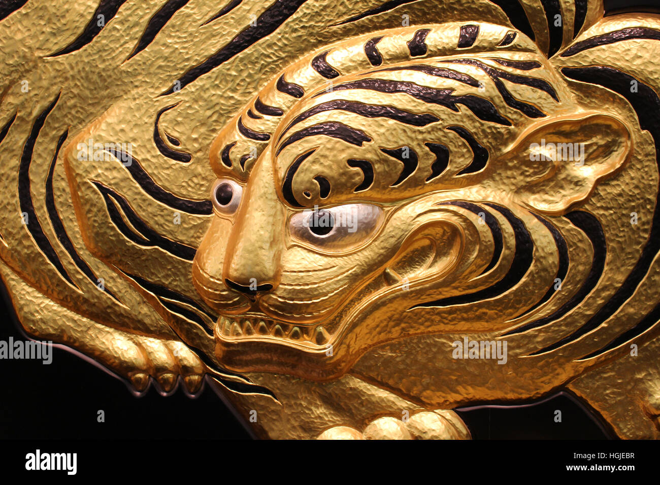 Gold crouching tiger panel in Osaka Castle, Osaka, Japan Stock Photo